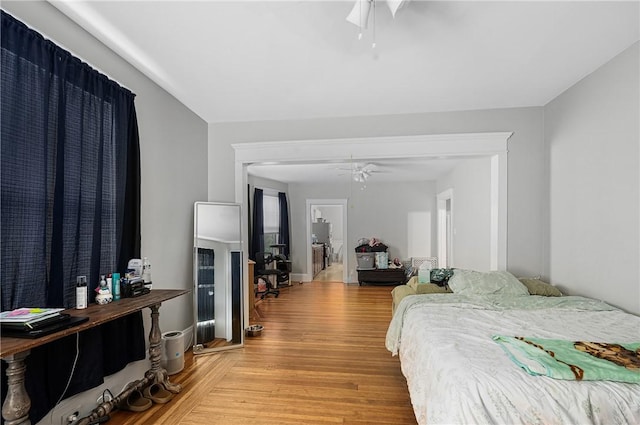 bedroom featuring light wood-style floors and a ceiling fan