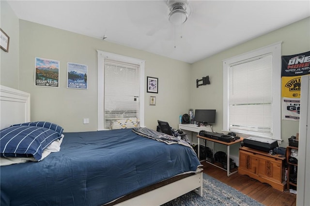 bedroom featuring wood finished floors and a ceiling fan