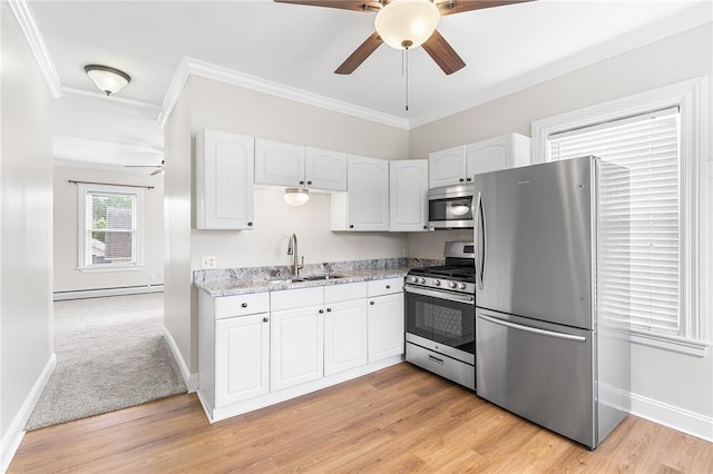 2 Francis St, Coventry, RI 02816 - kitchen featuring stainless steel appliances, a sink, ceiling fan, baseboard heating, and white cabinetry