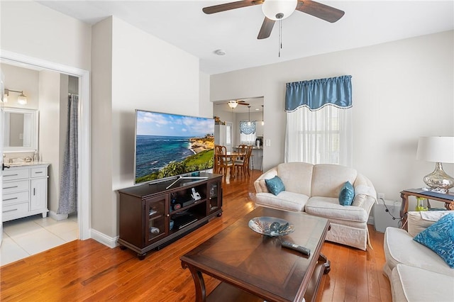 2 Francis St, Coventry, RI 02816 - living area featuring a ceiling fan, light wood-style floors, and baseboards