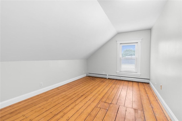 2 Francis St, Coventry, RI 02816 - additional living space with a baseboard heating unit, vaulted ceiling, light wood finished floors, and baseboards