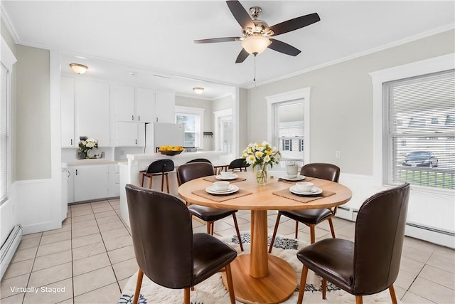 2 Francis St, Coventry, RI 02816 - dining room with light tile patterned floors, a ceiling fan, wainscoting, crown molding, and baseboard heating