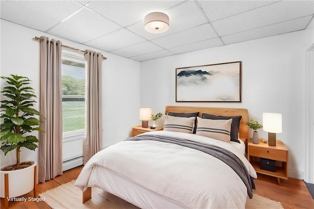 2 Francis St, Coventry, RI 02816 - bedroom featuring a paneled ceiling, light wood-style flooring, and baseboard heating