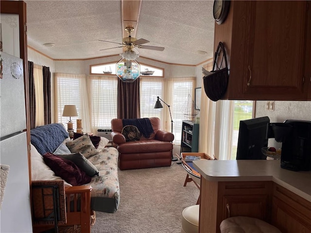 118 Dunns Corner Rd, Westerly, RI 02891 - living area with light carpet, a ceiling fan, a textured ceiling, healthy amount of natural light, and ornamental molding