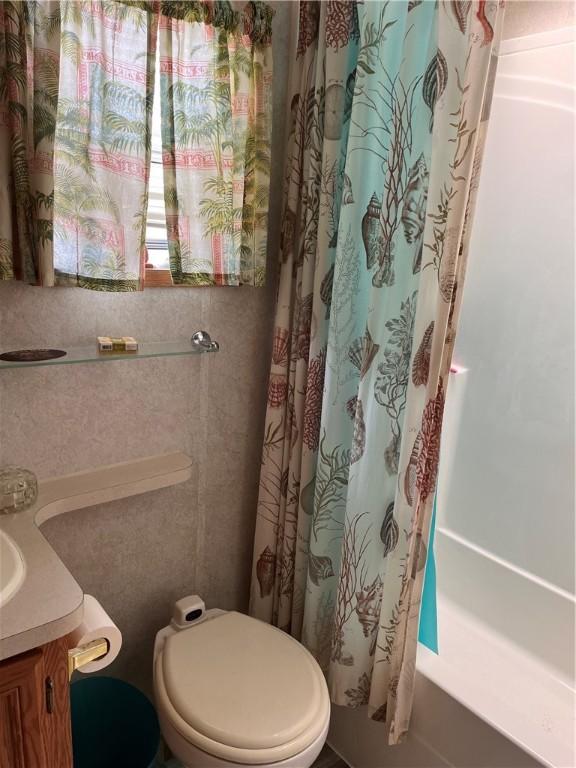 118 Dunns Corner Rd, Westerly, RI 02891 - full bath with curtained shower, toilet, and vanity