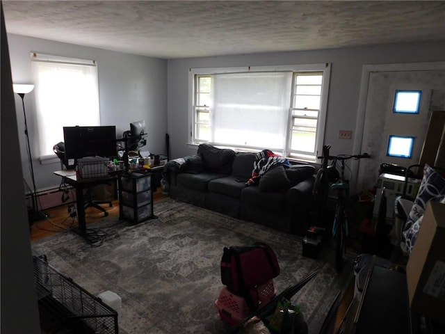 living room featuring a textured ceiling and an office area