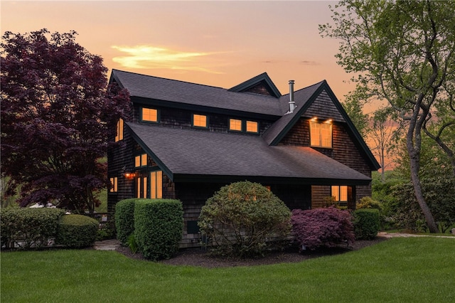 56 Summerfield Ln, Middletown, RI 02842 - view of front of house with roof with shingles and a yard