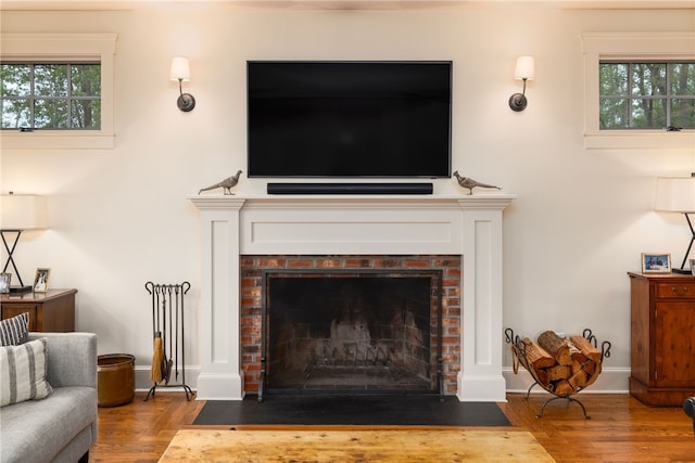 56 Summerfield Ln, Middletown, RI 02842 - living room with wood finished floors, a fireplace, and plenty of natural light