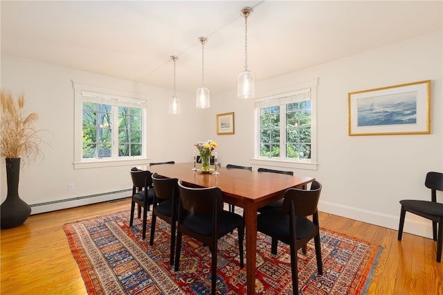 56 Summerfield Ln, Middletown, RI 02842 - dining space featuring a baseboard heating unit, plenty of natural light, light wood-style floors, and baseboards