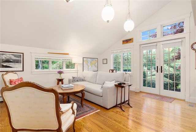 56 Summerfield Ln, Middletown, RI 02842 - living area featuring light wood-style floors, french doors, and high vaulted ceiling