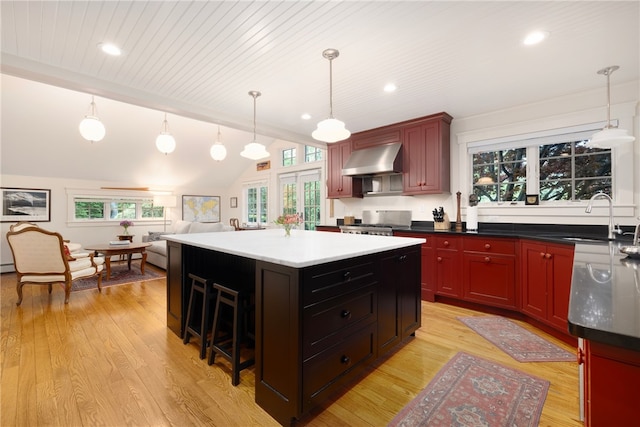 56 Summerfield Ln, Middletown, RI 02842 - kitchen with a sink, wall chimney exhaust hood, healthy amount of natural light, a center island, and wooden ceiling
