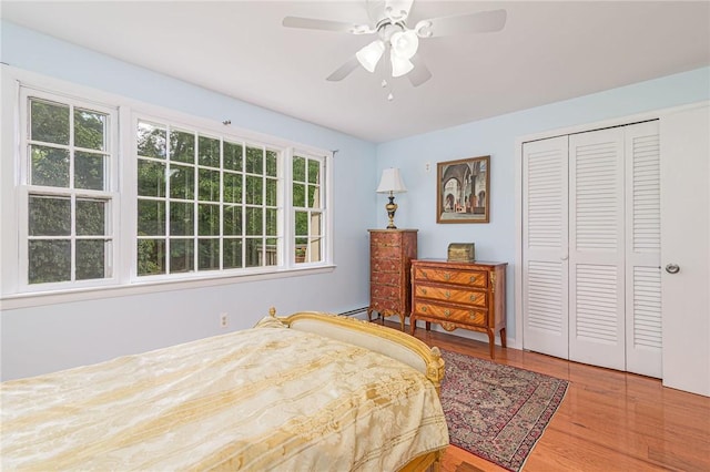 40 Haverhill Ave, North Kingstown, RI 02852 - bedroom featuring wood finished floors, a closet, ceiling fan, and a baseboard radiator