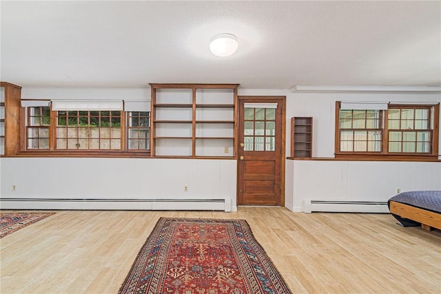 40 Haverhill Ave, North Kingstown, RI 02852 - entrance foyer with wood finished floors, a baseboard radiator, plenty of natural light, and wooden walls