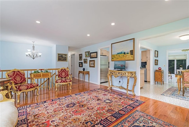 40 Haverhill Ave, North Kingstown, RI 02852 - living area with a chandelier, wood finished floors, recessed lighting, and baseboards