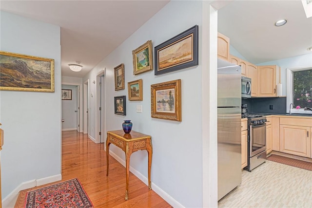 40 Haverhill Ave, North Kingstown, RI 02852 - hallway with light wood finished floors, baseboards, and recessed lighting