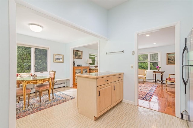 40 Haverhill Ave, North Kingstown, RI 02852 - kitchen featuring light brown cabinetry, recessed lighting, light wood-type flooring, freestanding refrigerator, and tile countertops