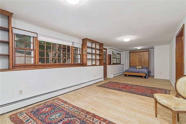 40 Haverhill Ave, North Kingstown, RI 02852 - bedroom with a baseboard radiator and wood finished floors