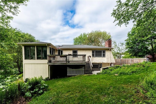 40 Haverhill Ave, North Kingstown, RI 02852 - back of property with a chimney, a deck, stairs, and a sunroom