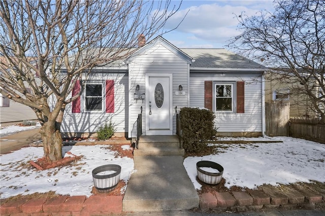 104 Liberty St, Pawtucket, RI 02861 - view of front facade featuring a chimney and roof with shingles