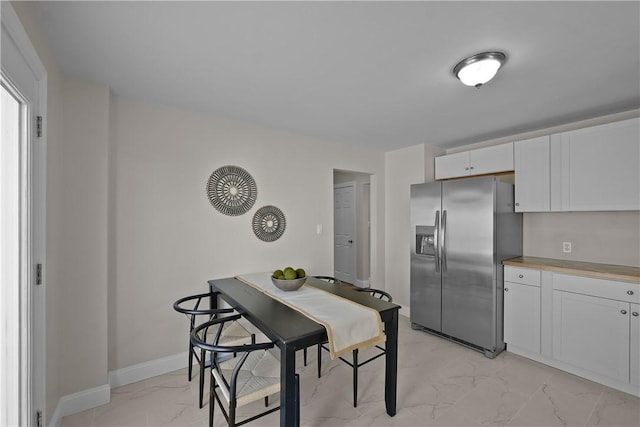 104 Liberty St, Pawtucket, RI 02861 - dining room with light marble finish floors and baseboards
