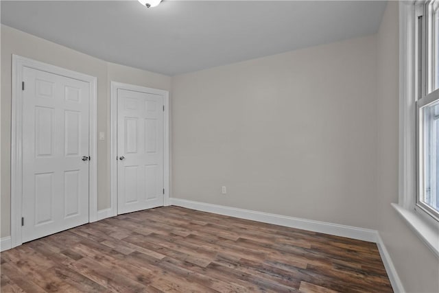 104 Liberty St, Pawtucket, RI 02861 - empty room featuring dark wood finished floors and baseboards