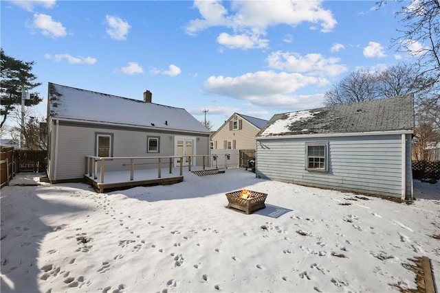 104 Liberty St, Pawtucket, RI 02861 - snow covered property with an outdoor fire pit, a deck, and a chimney