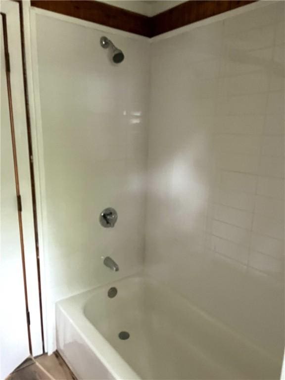 full bath featuring shower / washtub combination