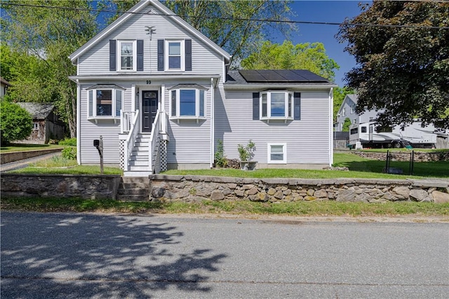 99 Fairfield Ave, Woonsocket, RI 02895 - view of front of house featuring roof mounted solar panels