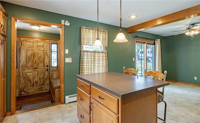 99 Fairfield Ave, Woonsocket, RI 02895 - kitchen featuring dark countertops, a baseboard heating unit, beam ceiling, a center island, and a kitchen breakfast bar
