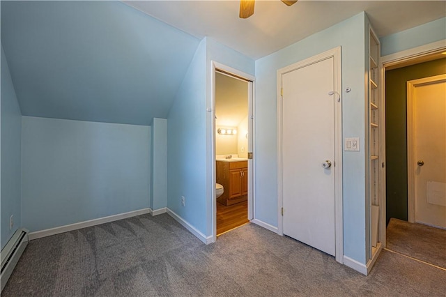 99 Fairfield Ave, Woonsocket, RI 02895 - unfurnished bedroom with a baseboard radiator, carpet floors, ensuite bath, lofted ceiling, and baseboards