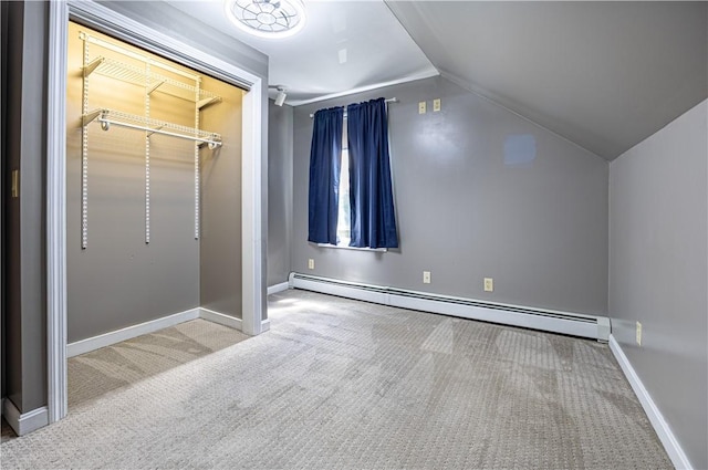 99 Fairfield Ave, Woonsocket, RI 02895 - unfurnished bedroom featuring a baseboard heating unit, carpet flooring, vaulted ceiling, baseboards, and a closet