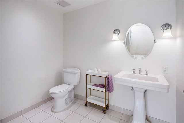 1 Tower Dr Unit 203, Portsmouth, RI 02871 - half bathroom featuring toilet, tile patterned floors, and baseboards