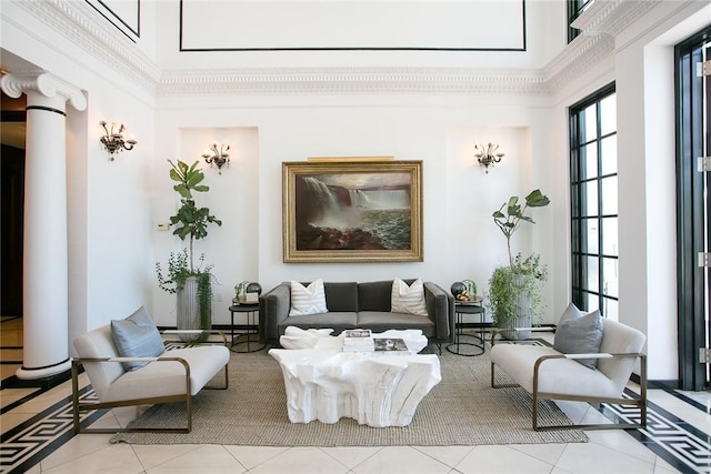 1 Tower Dr Unit 203, Portsmouth, RI 02871 - living area featuring a high ceiling, tile patterned flooring, and decorative columns