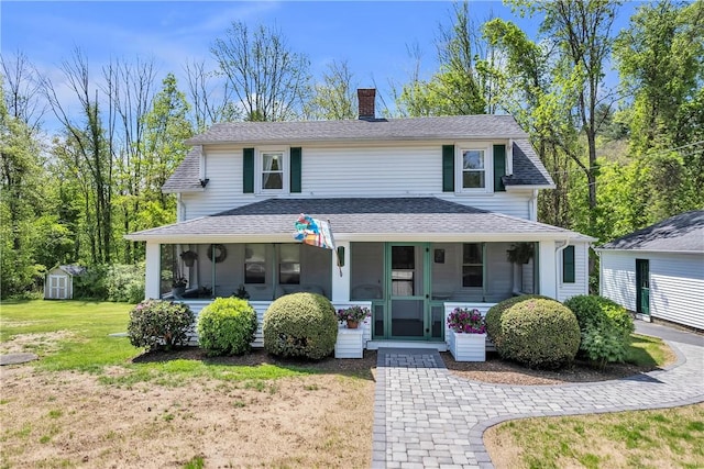 72 Old Danielson Pike, Foster, RI 02825 - view of front of home featuring a chimney, covered porch, a front lawn, and roof with shingles