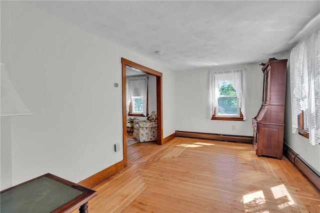 72 Old Danielson Pike, Foster, RI 02825 - spare room with a baseboard heating unit, baseboards, and light wood finished floors