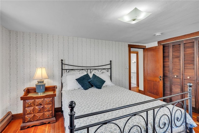 72 Old Danielson Pike, Foster, RI 02825 - bedroom with a baseboard radiator, wood finished floors, and a closet