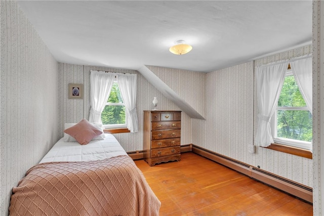 72 Old Danielson Pike, Foster, RI 02825 - bedroom with wallpapered walls, light wood finished floors, and baseboard heating