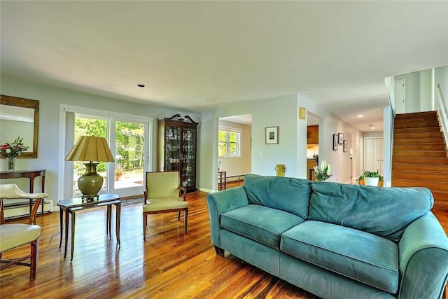 9 Misty River Ter, Narragansett, RI 02874 - living room featuring baseboard heating, stairway, wood finished floors, recessed lighting, and baseboards