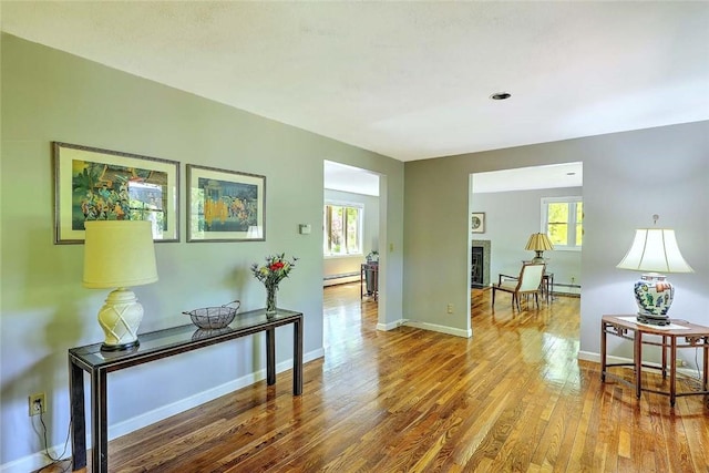 9 Misty River Ter, Narragansett, RI 02874 - hall featuring baseboard heating, wood finished floors, a baseboard heating unit, and baseboards