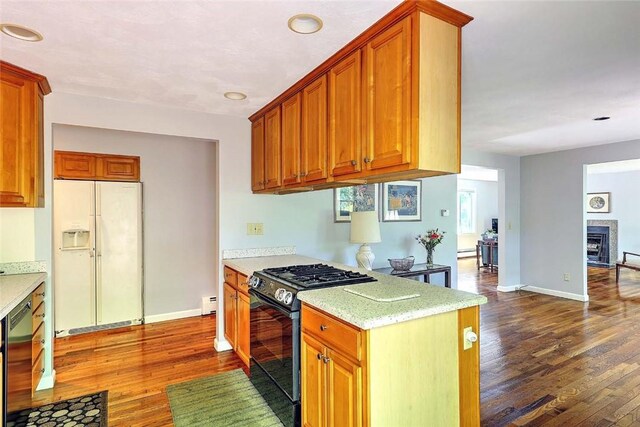 9 Misty River Ter, Narragansett, RI 02874 - kitchen with white fridge with ice dispenser, black gas range oven, dark wood finished floors, and dishwashing machine