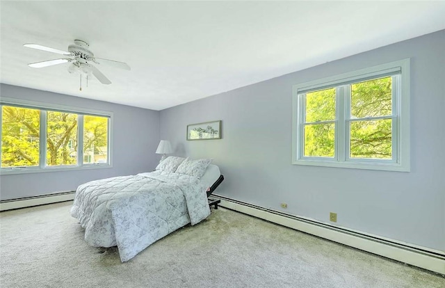 9 Misty River Ter, Narragansett, RI 02874 - carpeted bedroom with a baseboard radiator, multiple windows, and a ceiling fan
