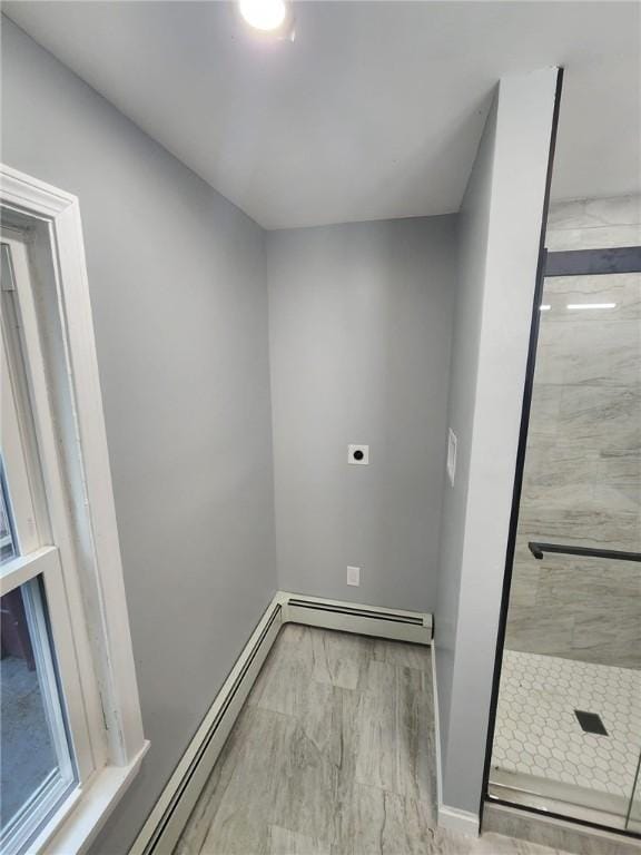 45 Ross St, Woonsocket, RI 02895 - washroom with hookup for an electric dryer, a baseboard heating unit, baseboard heating, and baseboards