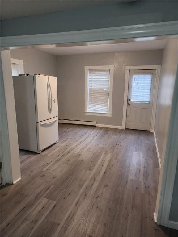 45 Ross St, Woonsocket, RI 02895 - interior space with a baseboard heating unit, wood finished floors, and baseboards