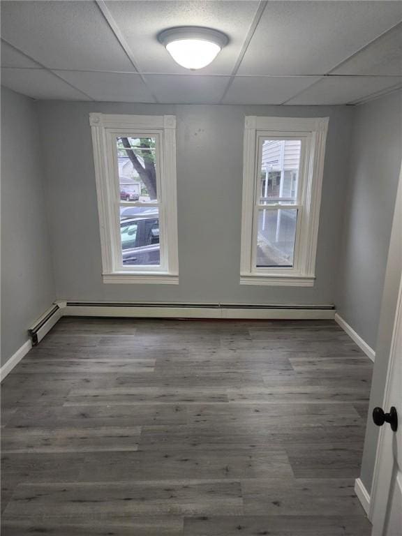 45 Ross St, Woonsocket, RI 02895 - spare room with a paneled ceiling, baseboards, and wood finished floors