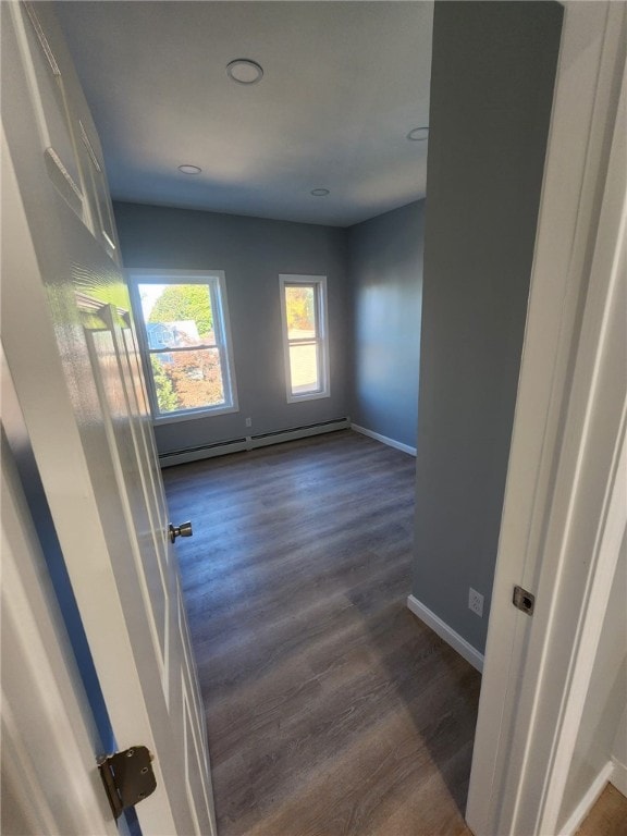 45 Ross St, Woonsocket, RI 02895 - empty room featuring a baseboard radiator, dark wood finished floors, baseboards, and recessed lighting