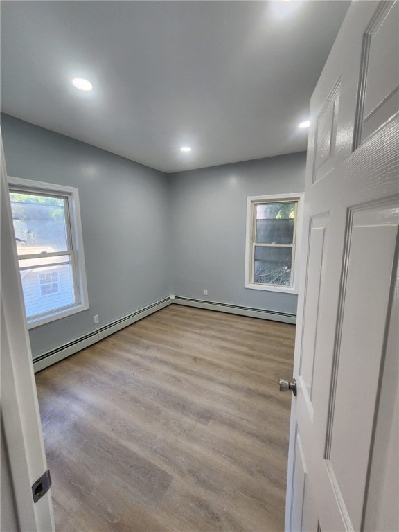 45 Ross St, Woonsocket, RI 02895 - spare room featuring healthy amount of natural light, wood finished floors, recessed lighting, and baseboard heating