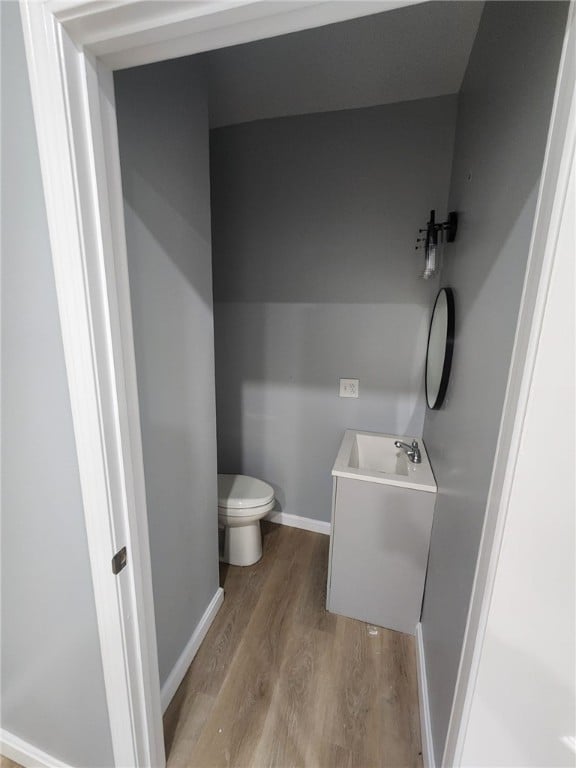45 Ross St, Woonsocket, RI 02895 - bathroom with toilet, vanity, wood finished floors, and baseboards
