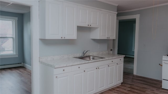 45 Ross St, Woonsocket, RI 02895 - kitchen featuring a sink, a baseboard heating unit, light countertops, dark wood finished floors, and white cabinets