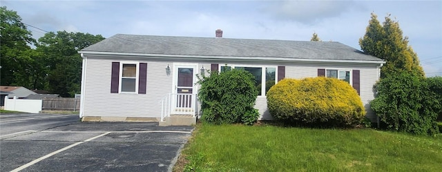 1815 Mineral Spring Ave, North Providence, RI 02904 - bungalow with a chimney and uncovered parking