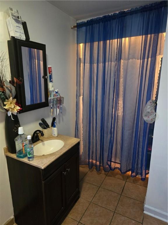 20 Pennsyjvania Ave, Providence, RI 02905 - bathroom featuring vanity and tile patterned floors
